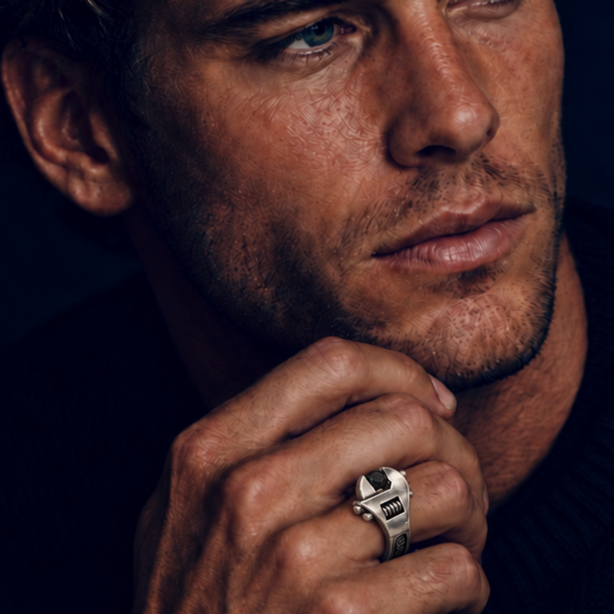 Model wearing a sterling-silver Wrench Ring and Wrench Cuff with black diamonds by Nicolas Ambrosio Jewelry.