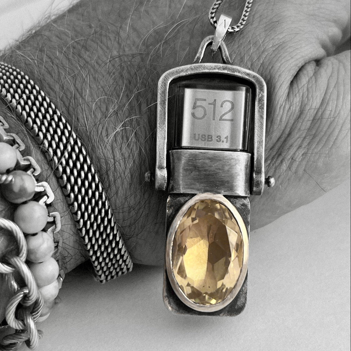 Front view of the 512GB USB Drives Necklace worn on the wrist, handcrafted in sterling silver with champagne citrine.